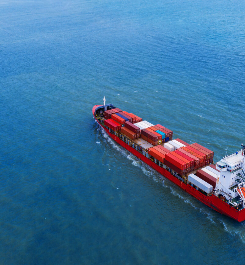 Aerial view of container cargo ship in sea.